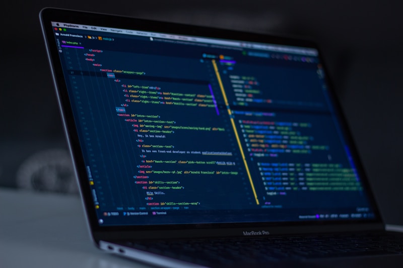 Computer screen displaying code in a dark environment with syntax highlighting